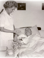1970 photo of a nurse beside with a patient