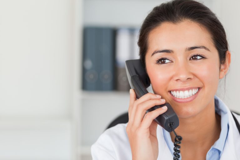 medical receptionist answering phone