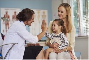Mother and daughter talking with a doctor